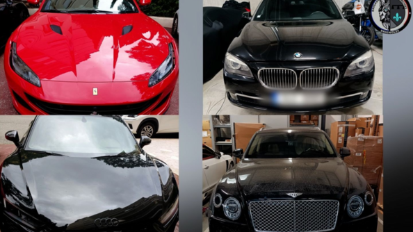 Quatre v&eacute;hicule de luxe vus de face: une ferrari rouge, une bmw noire, une aston martin noire et une audi noire