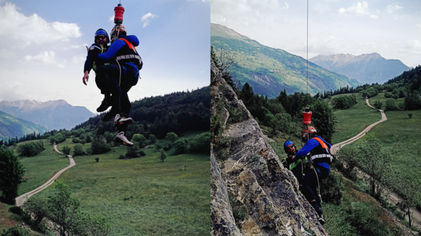 Nils Allègre et un gendarme de PGHM descendent par un treuil sur une falaise